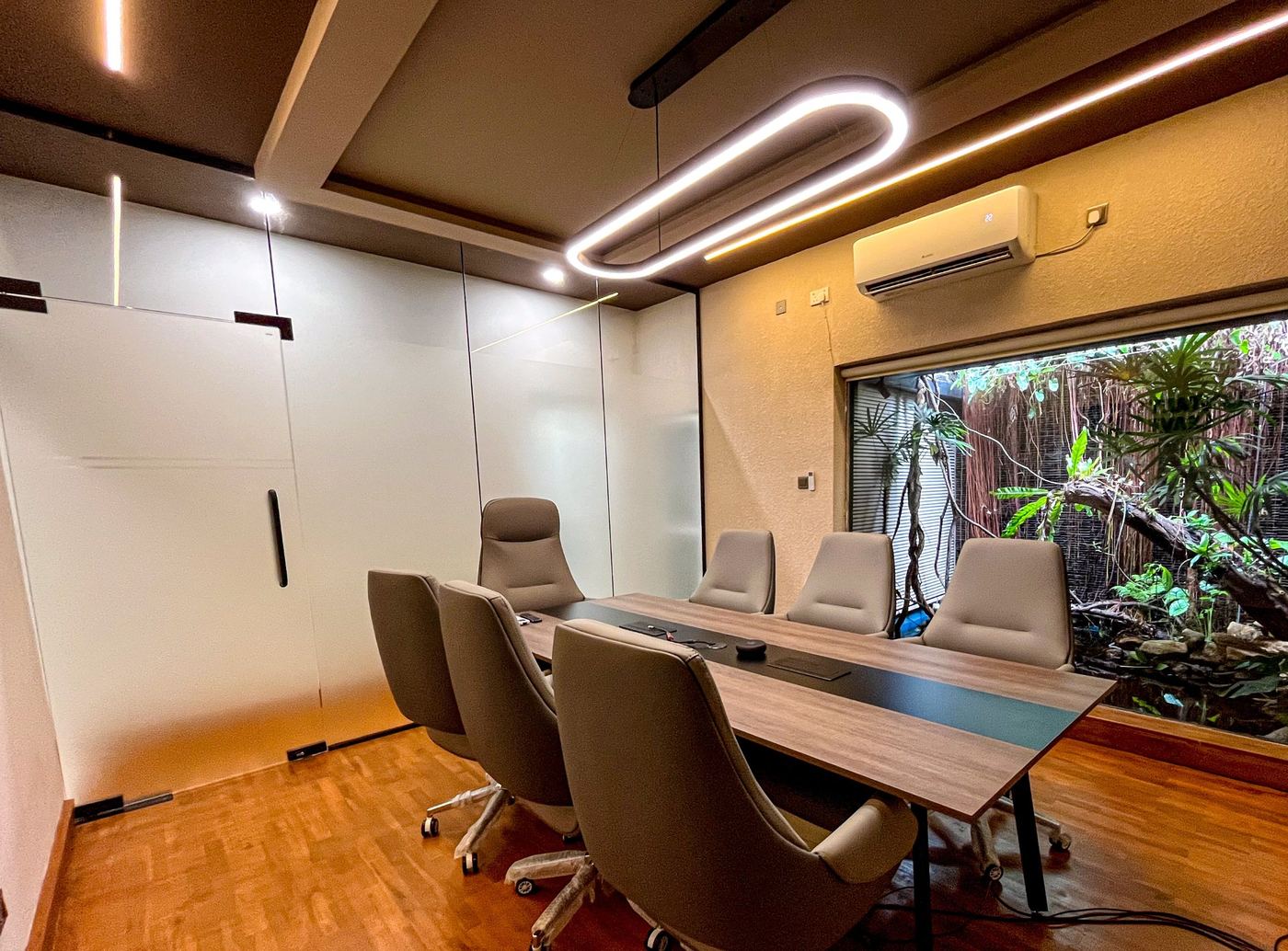 Meeting room side view with seating for 8