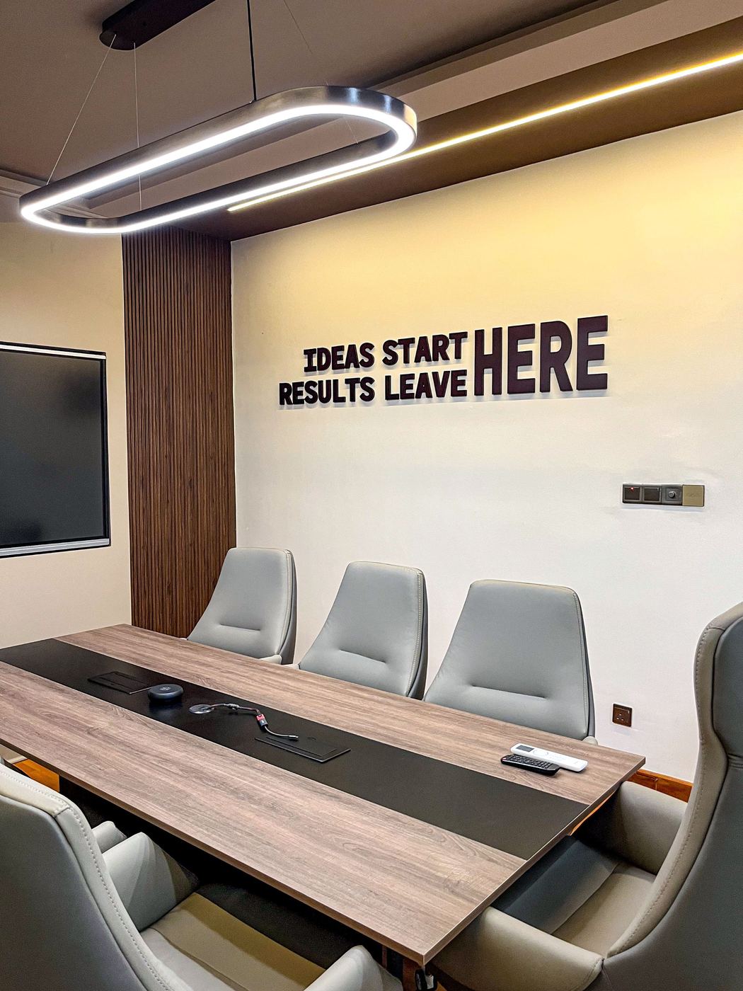 Meeting room wall signage — Ideas Start Here, Results Leave Here